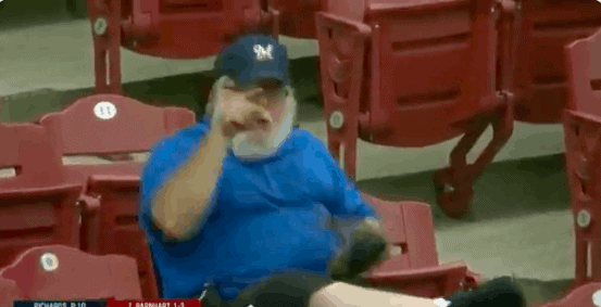 A Milwaukee Brewers fan is trending after tearing into a Reds fan who got in his way of catching a foul ball on Thursday