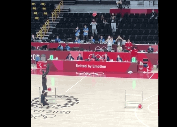 robot at olympic games playing basketball