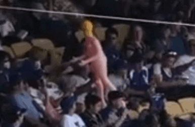fans pass around blow up doll at Dodgers game
