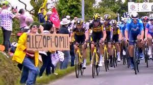 The Tour de France announced their plans to drop the lawsuit against the woman who cause a nasty wreck by waving her sign in the road